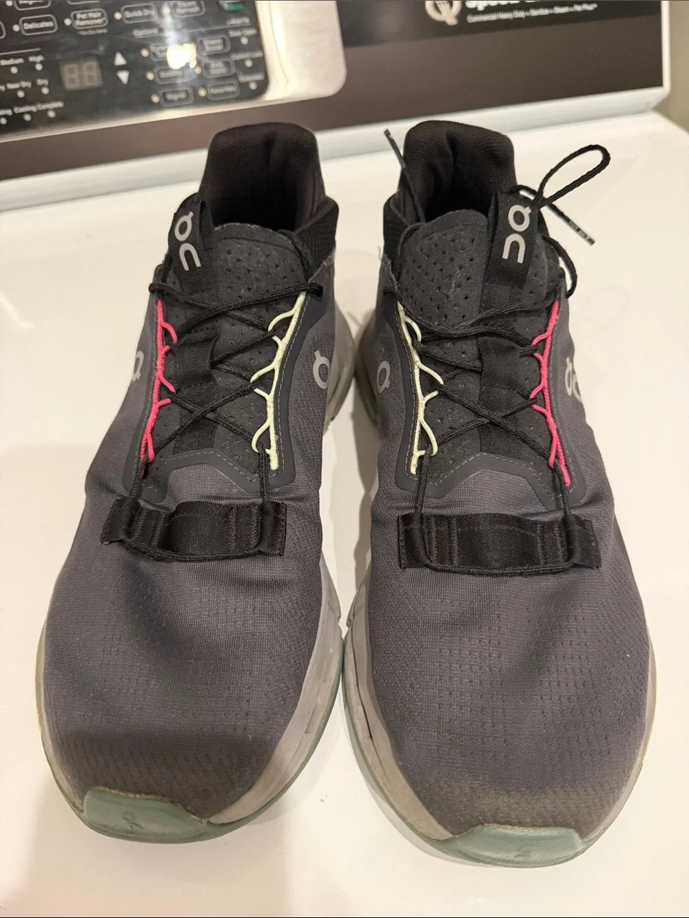 On Running woman’s Black Athletic Shoes with Lime and Pink Accents